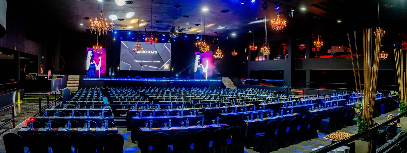 Gallery of Groups: Large event hall prepared for a show or conference at the hotel Grand Oasis Cancun.