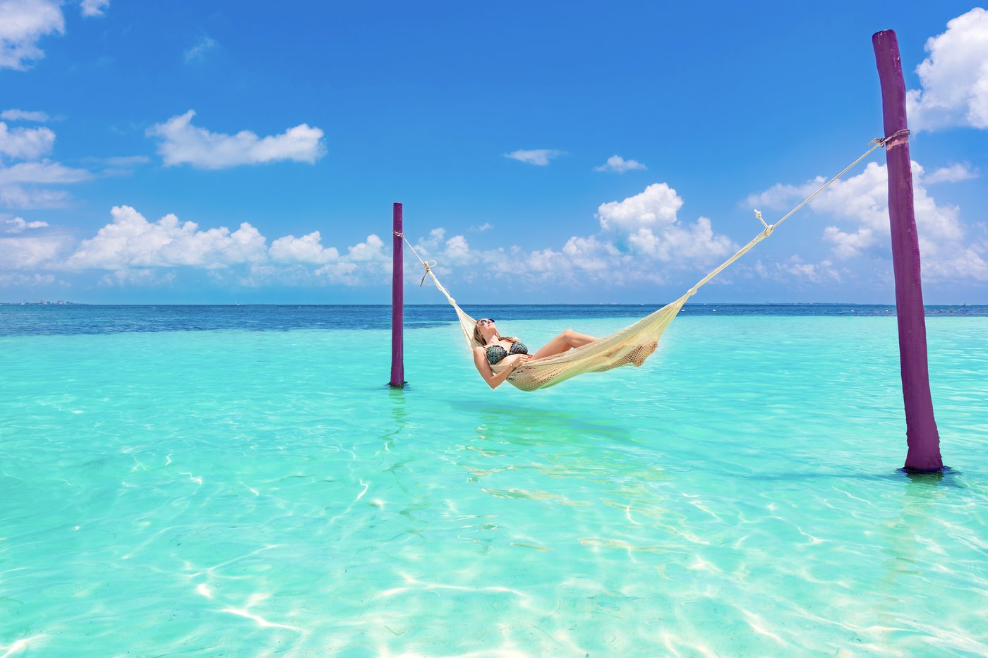 Hammock over the water on the beach at the hotel Grand Oasis Palm.