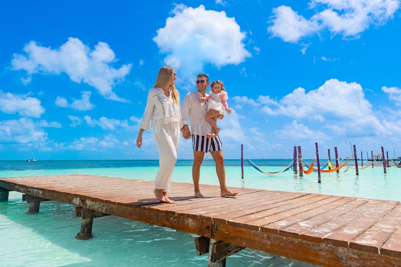 Family having fun on the beach of the hotel Grand Oasis Palm.