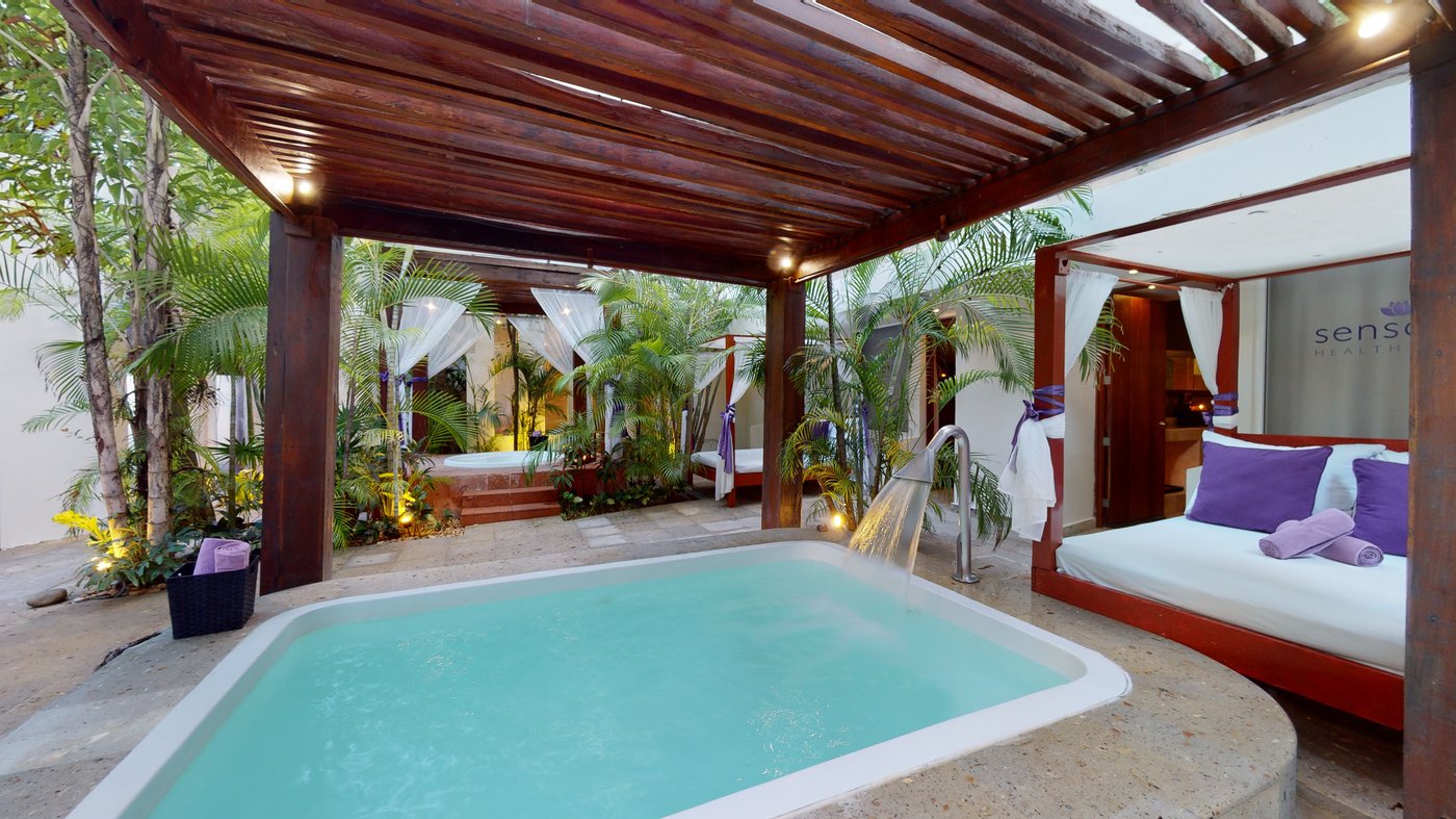 Pool in the spa area of the hotel Grand Oasis Palm with lounge beds.